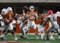 AUSTIN, TX - OCTOBER 19: Georgia Bulldogs linebacker Jalon Walker (11) forces a fumble on Texas Longhorns quarterback Arch Manning (16) during the SEC college football game between Texas Longhorns and Georgia Bulldogs on October 19, 2024, at Darrell K Royal - Texas Memorial Stadium in Austin, TX.  (Photo by David Buono/Icon Sportswire via Getty Images)