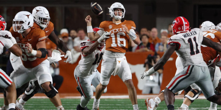 AUSTIN, TX - OCTOBER 19: Georgia Bulldogs linebacker Jalon Walker (11) forces a fumble on Texas Longhorns quarterback Arch Manning (16) during the SEC college football game between Texas Longhorns and Georgia Bulldogs on October 19, 2024, at Darrell K Royal - Texas Memorial Stadium in Austin, TX.  (Photo by David Buono/Icon Sportswire via Getty Images)