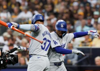 Dodgers Mookie Betts celebrates with Teoscar Hernandez after hitting a solo home run during Game 4