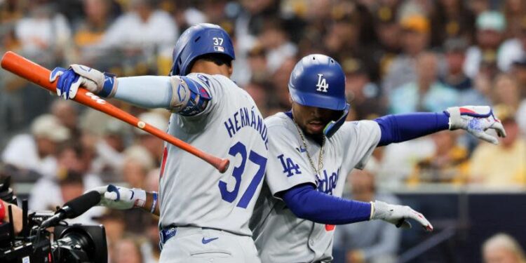 Dodgers Mookie Betts celebrates with Teoscar Hernandez after hitting a solo home run during Game 4