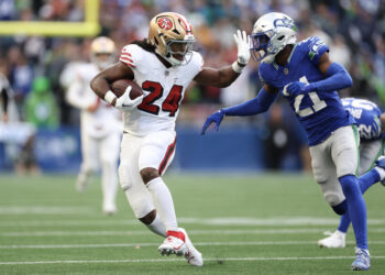 Jordan Mason of the San Francisco 49ers left Thursday night's game with an injury. (Photo by Steph Chambers/Getty Images)