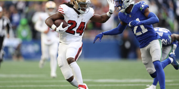 Jordan Mason of the San Francisco 49ers left Thursday night's game with an injury. (Photo by Steph Chambers/Getty Images)