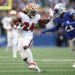 Jordan Mason of the San Francisco 49ers left Thursday night's game with an injury. (Photo by Steph Chambers/Getty Images)