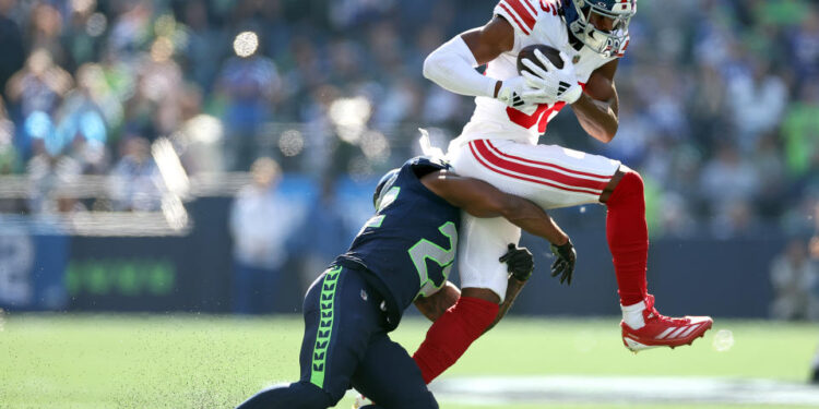 Darius Slayton outstretched his arms and pointed his fingers downfield after making a catch on Sunday afternoon against the Seahawks