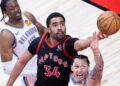 Jontay Porter C of Toronto Raptors fights for a rebound with Lindy Waters III R of Oklahoma City Thunder during the 2023-2024 NBA regular season game between Toronto Raptors and Oklahoma City Thunder in Toronto, Canada, March 22, 2024. (Photo by Zou Zheng/Xinhua via Getty Images)