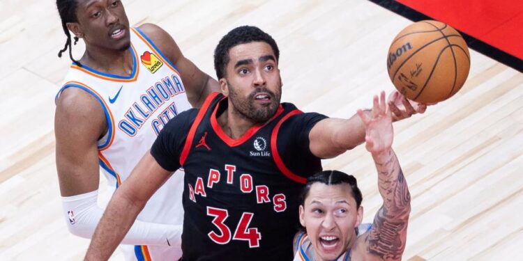 Jontay Porter C of Toronto Raptors fights for a rebound with Lindy Waters III R of Oklahoma City Thunder during the 2023-2024 NBA regular season game between Toronto Raptors and Oklahoma City Thunder in Toronto, Canada, March 22, 2024. (Photo by Zou Zheng/Xinhua via Getty Images)