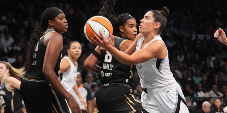 Sep 29, 2024; Brooklyn, New York, USA; Las Vegas Aces guard Kelsey Plum (10) shoots a layup against the New York Liberty during game one of the 2024 WNBA Semi-finals at Barclays Center. Mandatory Credit: Gregory Fisher-Imagn Images