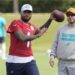 Miami Dolphins quarterback Tua Tagovailoa (1) aims a pass during a practice session at the team's training facility, Wednesday, Oct. 23, 2024, in Miami Gardens, Fla. (AP Photo/Marta Lavandier)