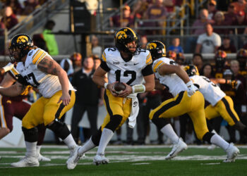 MINNEAPOLIS, MN - SEPTEMBER 21: Iowa Hawkeyes QB Cade McNamara (12) drops back to pass during game between the Iowa Hawkeyes and the Minnesota Golden Gophers on September 21, 2024, at Huntington Bank Stadium in Minneapolis, MN. (Photo by John Rivera/Icon Sportswire via Getty Images)