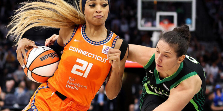 Oct 1, 2024; Minneapolis, Minnesota, USA; Connecticut Sun guard DiJonai Carrington (21) works around Minnesota Lynx forward Cecilia Zandalasini (9) during the second half of game two of the 2024 WNBA Semi-finals at Target Center. Mandatory Credit: Matt Krohn-Imagn Images     TPX IMAGES OF THE DAY