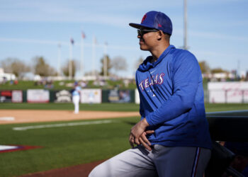 SURPRISE, AZ - FEBRUARY 24: Will Venable #83 of the Texas Rangers looks on during a game against the Kansas City Royals as part of the Spring Training at Surprise Stadium on February 24, 2023 in Surprise, Arizona. (Photo by Ben Ludeman/Texas Rangers/Getty Images)