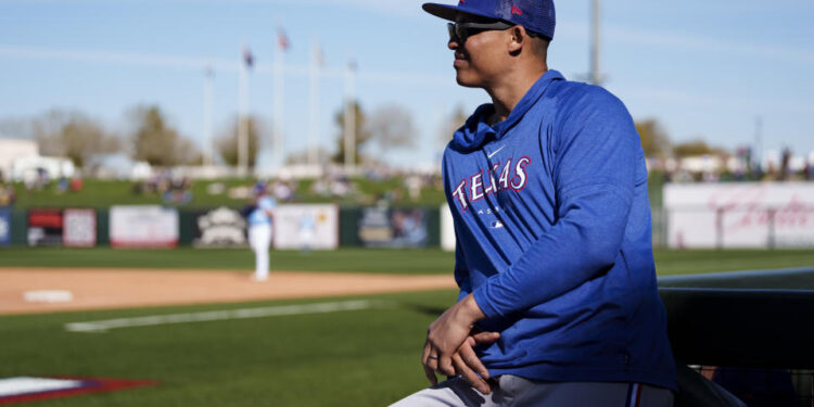 SURPRISE, AZ - FEBRUARY 24: Will Venable #83 of the Texas Rangers looks on during a game against the Kansas City Royals as part of the Spring Training at Surprise Stadium on February 24, 2023 in Surprise, Arizona. (Photo by Ben Ludeman/Texas Rangers/Getty Images)