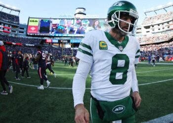 <span>Aaron Rodgers leaves the field after a dispiriting defeat to the New England Patriots.</span><span>Illustration: Adam Glanzman/Getty Images</span>