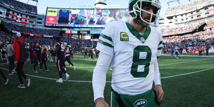 <span>Aaron Rodgers leaves the field after a dispiriting defeat to the New England Patriots.</span><span>Illustration: Adam Glanzman/Getty Images</span>