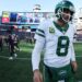 <span>Aaron Rodgers leaves the field after a dispiriting defeat to the New England Patriots.</span><span>Illustration: Adam Glanzman/Getty Images</span>