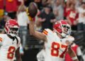 Travis Kelce spikes the ball