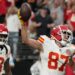 Travis Kelce spikes the ball