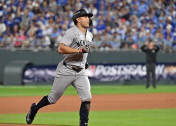 Oct 9, 2024; Kansas City, Missouri, USA; New York Yankees designated hitter Giancarlo Stanton (27) runs the bases after hitting a home run in the eighth inning against the Kansas City Royals during game three of the NLDS for the 2024 MLB Playoffs at Kauffman Stadium. Mandatory Credit: Peter Aiken-Imagn Images