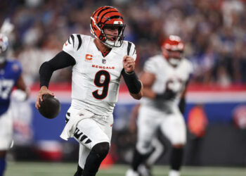 Joe Burrow of the Cincinnati Bengals runs the ball against the Giants. (Photo by Kevin Sabitus/Getty Images)