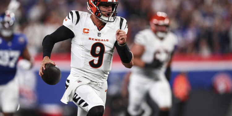 Joe Burrow of the Cincinnati Bengals runs the ball against the Giants. (Photo by Kevin Sabitus/Getty Images)