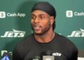 Davante Adams talks to reporters