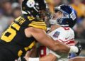 New York Giants quarterback Daniel Jones (8) is hit by Pittsburgh Steelers linebacker Alex Highsmith (56) during the first quarter at Acrisure Stadium