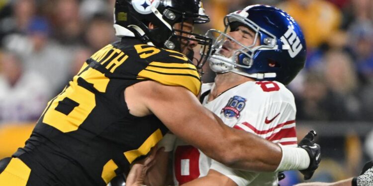 New York Giants quarterback Daniel Jones (8) is hit by Pittsburgh Steelers linebacker Alex Highsmith (56) during the first quarter at Acrisure Stadium