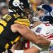 New York Giants quarterback Daniel Jones (8) is hit by Pittsburgh Steelers linebacker Alex Highsmith (56) during the first quarter at Acrisure Stadium