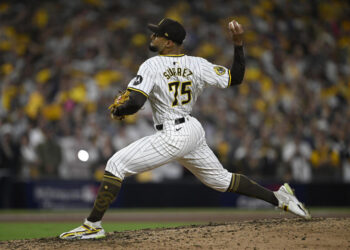 Oct 2, 2024; San Diego, California, USA; San Diego Padres pitcher Robert Suarez (75) throws during the ninth inning of game two in the Wildcard round for the 2024 MLB Playoffs against the Atlanta Braves at Petco Park. Mandatory Credit: Denis Poroy-Imagn Images