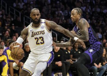 Los Angeles Lakers forward LeBron James (23) drives the ball past Sacramento Kings forward DeMar DeRozan, right, during the first half of an NBA basketball game Saturday, Oct. 26, 2024, in Los Angeles. (AP Photo/William Liang)