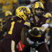 Minnesota quarterback Max Brosmer, right, hands the ball off to running back Darius Taylor (1) during the first half of an NCAA college football game against Southern California, Saturday, Oct. 5, 2024, in Minneapolis. (AP Photo/Ellen Schmidt)