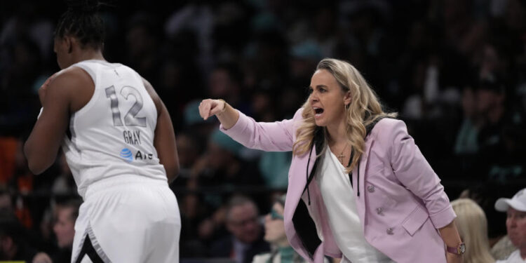 New York Liberty head coach Becky Hammon during the first half of a WNBA basketball semifinal game against the New York Liberty, Tuesday, Oct. 1, 2024, in New York. (AP Photo/Frank Franklin II)