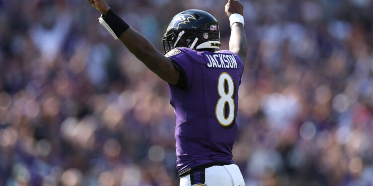 Lamar Jackson #8 of the Baltimore Ravens celebrates after teammate Derrick Henry #22 scores a touchdown against the Washington Commanders during the second quarter at M&T Bank Stadium on October 13, 2024 in Baltimore, Maryland. (Photo by Patrick Smith/Getty Images)