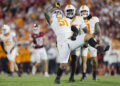 NORMAN, OKLAHOMA - SEPTEMBER 21:  Defensive lineman Jaxson Moi #51 of the Tennessee Volunteers celebrates his sack against the Oklahoma Sooners with defensive back Christian Harrison #5 and linebacker Keenan Pili #11 in the fourth quarter at Gaylord Family Oklahoma Memorial Stadium on September 21, 2024 in Norman, Oklahoma.   Tennessee won 25-15. (Photo by Brian Bahr/Getty Images)