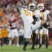 NORMAN, OKLAHOMA - SEPTEMBER 21:  Defensive lineman Jaxson Moi #51 of the Tennessee Volunteers celebrates his sack against the Oklahoma Sooners with defensive back Christian Harrison #5 and linebacker Keenan Pili #11 in the fourth quarter at Gaylord Family Oklahoma Memorial Stadium on September 21, 2024 in Norman, Oklahoma.   Tennessee won 25-15. (Photo by Brian Bahr/Getty Images)