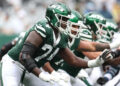 EAST RUTHERFORD, NEW JERSEY - SEPTEMBER 29: Olu Fashanu #74 of the New York Jets in action against the Denver Broncos at MetLife Stadium on September 29, 2024 in East Rutherford, New Jersey. (Photo by Luke Hales/Getty Images)