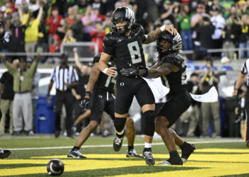 Oregon Ducks quarterback Dillon Gabriel celebrates after a touchdown on Saturday. (Troy Wayrynen-Imagn Images)