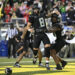 Oregon Ducks quarterback Dillon Gabriel celebrates after a touchdown on Saturday. (Troy Wayrynen-Imagn Images)