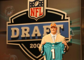 NEW YORK - APRIL 26:  Offensive Tackle Jake Long of Michigan holds up a jersey after being selected by the Miami Dolphins with the No.1 overall pick of the 2008 National Football League Draft on April 26, 2008 at Radio City Music Hall in New York City.  (Photo by Al Pereira/Getty Images)