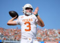 DALLAS, TEXAS - OCTOBER 12: Quinn Ewers #3 of the Texas Longhorns warms up prior to a game against the Oklahoma Sooners at Cotton Bowl Stadium on October 12, 2024 in Dallas, Texas. (Photo by Alex Slitz/Getty Images)