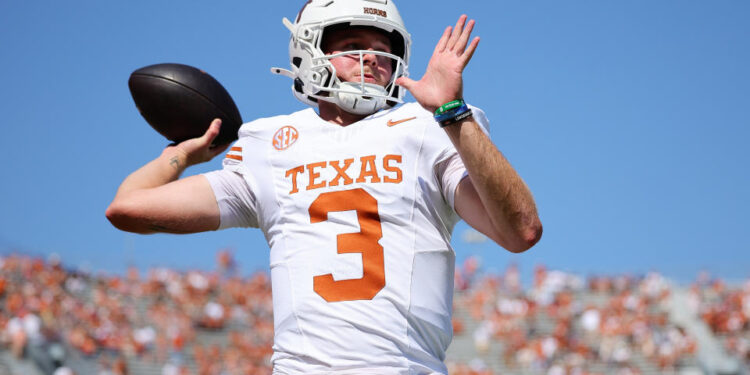 DALLAS, TEXAS - OCTOBER 12: Quinn Ewers #3 of the Texas Longhorns warms up prior to a game against the Oklahoma Sooners at Cotton Bowl Stadium on October 12, 2024 in Dallas, Texas. (Photo by Alex Slitz/Getty Images)