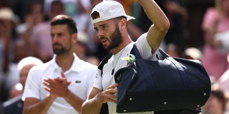 Jacob Fearnley is clapped off Centre Court by Novak Djokovic