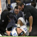 Detroit Lions defensive end Aidan Hutchinson (97) is attended to by team staff after suffering an unknown injury second half of an NFL football game against the Dallas Cowboys in Arlington, Texas, Sunday, Oct. 13, 2024. (AP Photo/Jerome Miron)