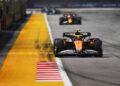 SINGAPORE, SINGAPORE - SEPTEMBER 22: Lando Norris of Great Britain driving the (4) McLaren MCL38 Mercedes leads Max Verstappen of the Netherlands driving the (1) Oracle Red Bull Racing RB20 on track during the F1 Grand Prix of Singapore at Marina Bay Street Circuit on September 22, 2024 in Singapore, Singapore. (Photo by Rudy Carezzevoli/Getty Images)