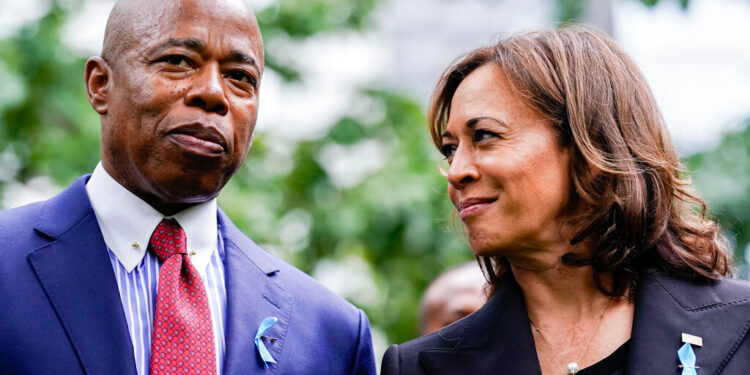 Vice President Kamala Harris speaks to New York City mayor Eric Adams at the ceremony to commemorate the 21st anniversary of the Sept. 11 terrorist attacks, Sunday, Sept. 11, 2022, at the National September 11 Memorial & Museum in New York. (AP Photo/Julia Nikhinson)