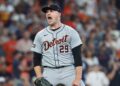 Tigers pitcher reacts during a game