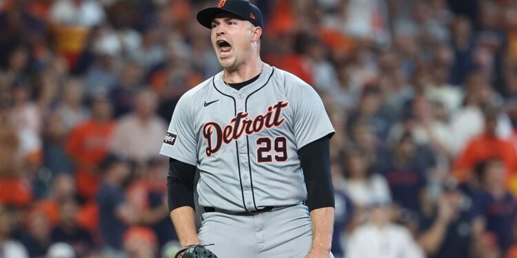 Tigers pitcher reacts during a game