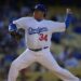 Fernando Valenzuela throws to the plate during the Old-Timers baseball game, June 8, 2013, in Los Angeles. Fernando Valenzuela, the Mexican-born phenom for the Los Angeles Dodgers who inspired “Fernandomania” while winning the NL Cy Young Award and Rookie of the Year in 1981, has died Tuesday, Oct. 22, 2024. (AP Photo/Mark J. Terrill, File)