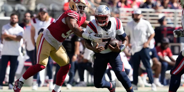 Jacoby Brissett tackled by Kevin Givens