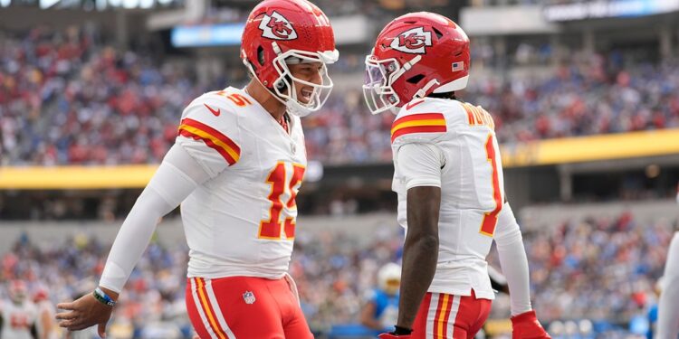 Patrick Mahomes and Xavier Worthy celebrate